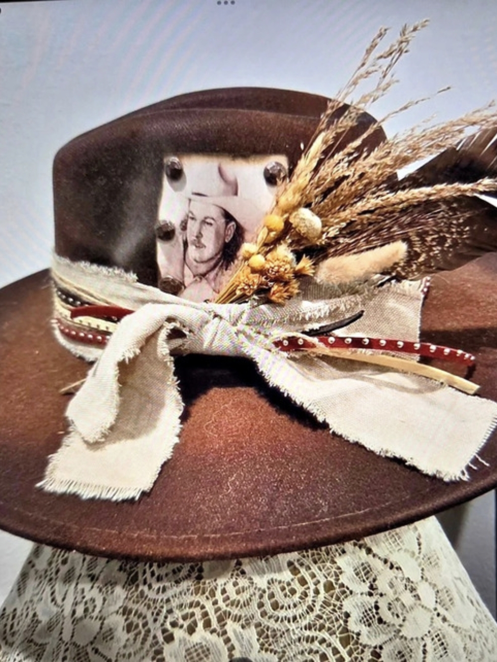 Brown Western Hat with Feather Band This Hat Is Adjustable To Fit Most.